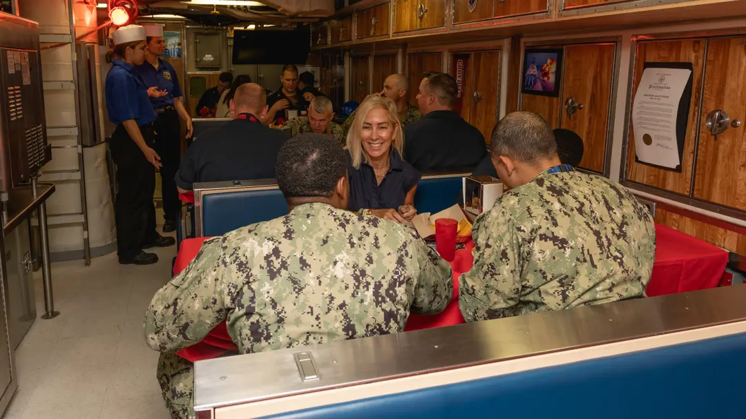 Sailors of Pre-Commissioning Unit New Jersey (SSN-796) share the crew's first meal aboard the boat at Newport News Shipbuilding in 2023.